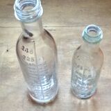 2 old graduated pharmacy bottles