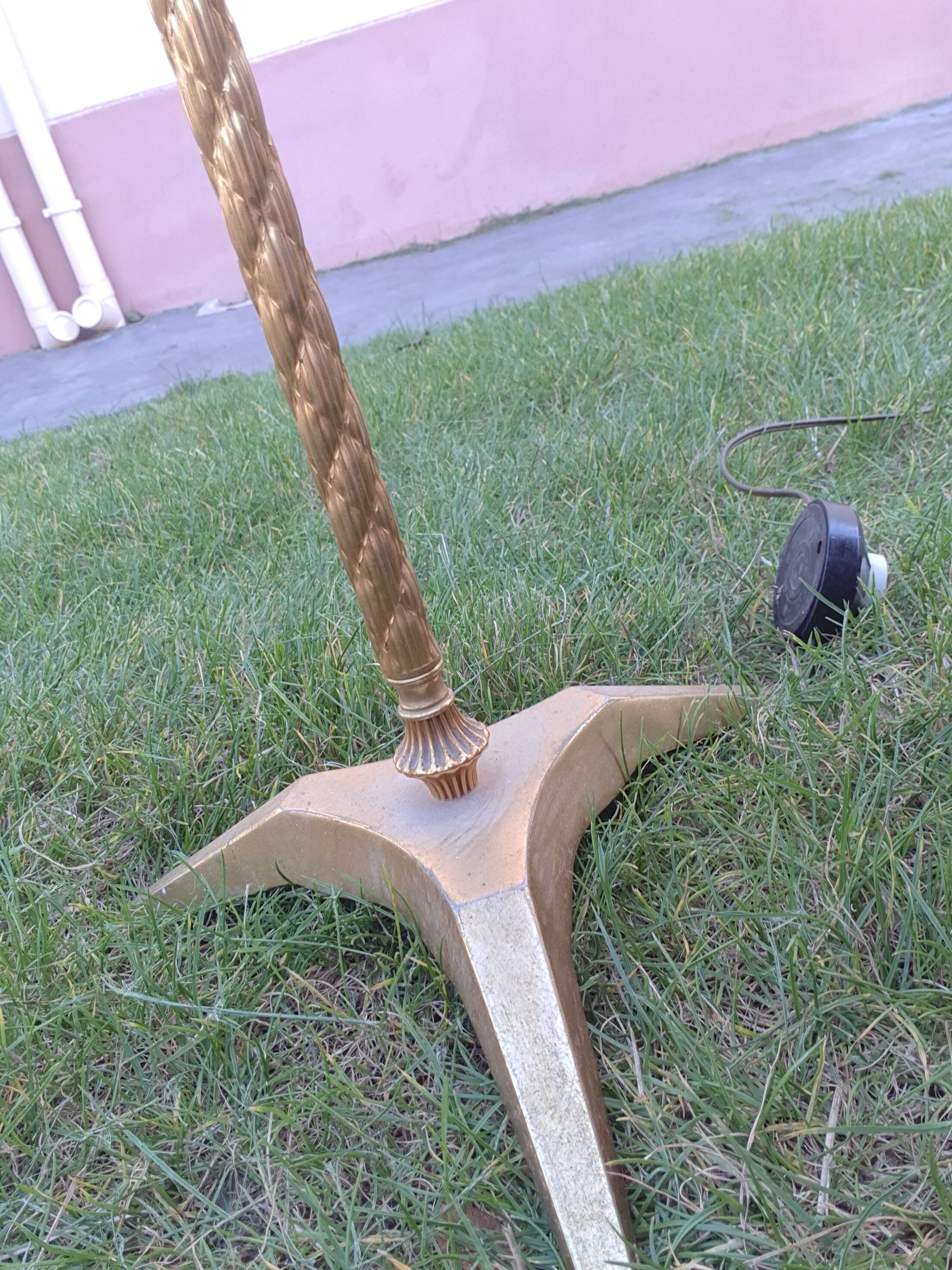 Twisted brass tripod floor lamp