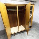 French wardrobe with tapered legs, 3 doors, 1 mirror (27*130), and 1 drawer.