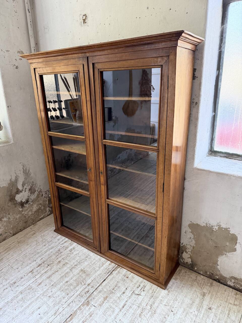 Glass-fronted walnut library 1900