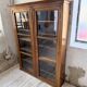 Glass-fronted walnut library 1900