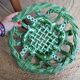Antique woven basket in green glazed ceramic, fish decoration