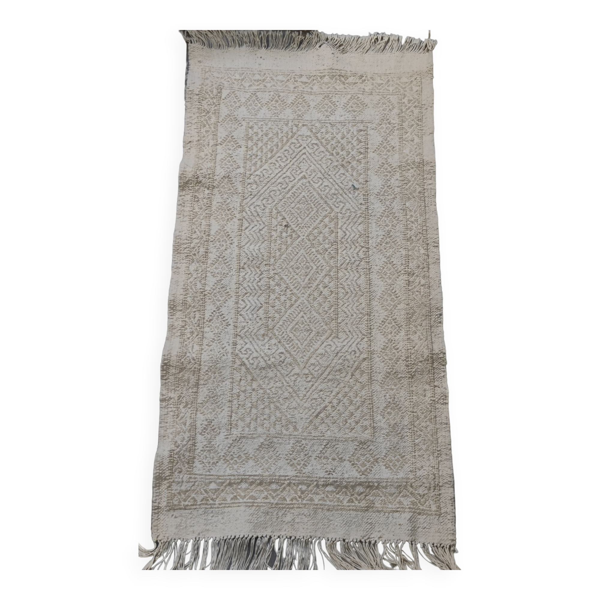 Hand-woven rug in natural wool