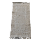 Hand-woven rug in natural wool