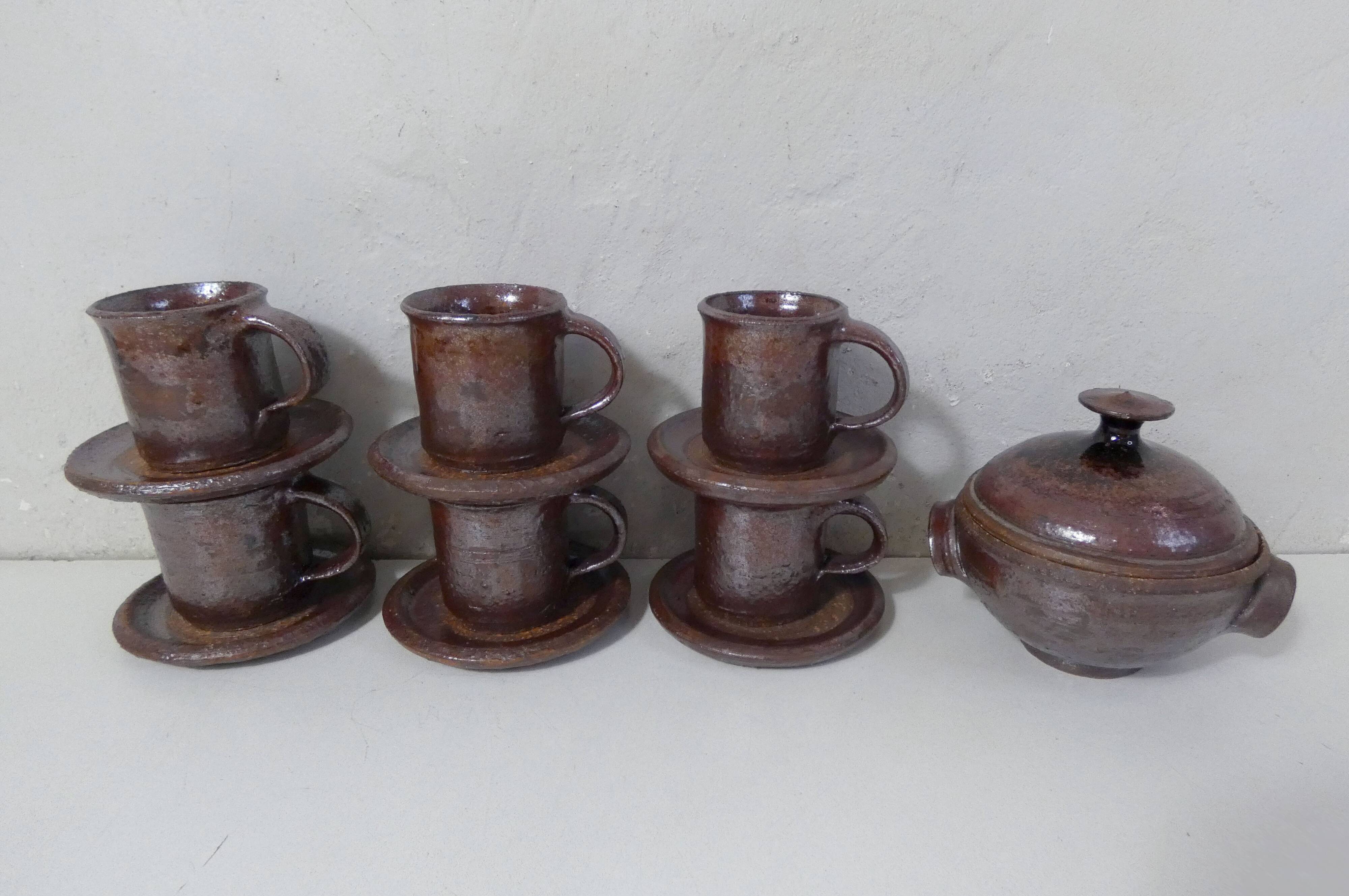 coffee service in iridescent stoneware cups and vintage sugar bowl