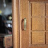 Vintage wooden wardrobe with sliding doors.