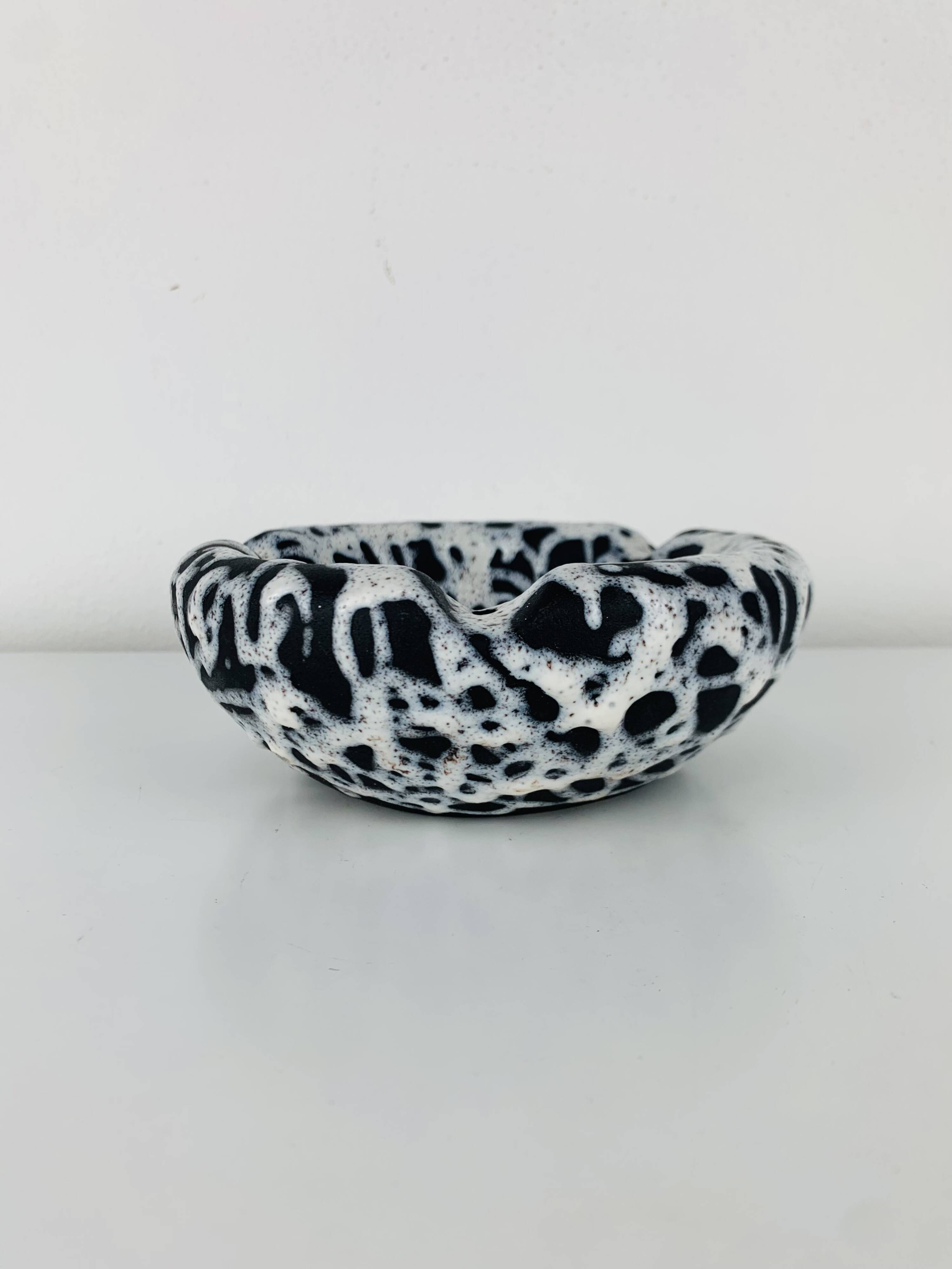 Ashtray and pocket tray by Marius Giuge, fat lava ceramic.