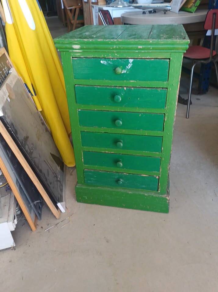 Vintage workshop furniture with 6 green drawers.