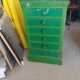 Vintage workshop furniture with 6 green drawers.