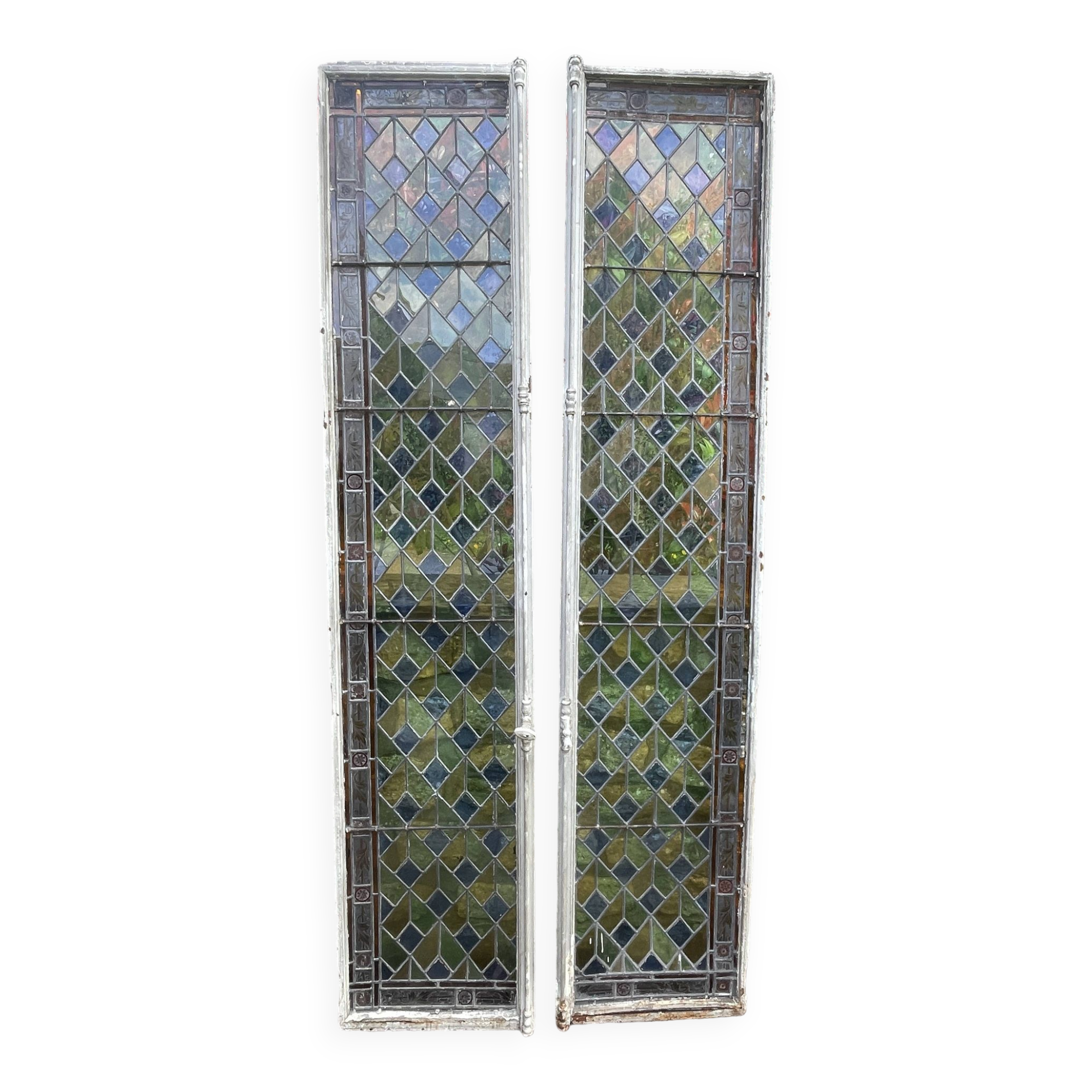 Pair of old double stained glass doors. Metal frames. Stained glass windows