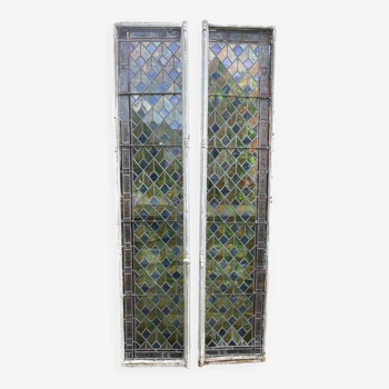 Pair of old double stained glass doors. Metal frames. Stained glass windows