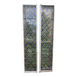 Pair of old double stained glass doors. Metal frames. Stained glass windows