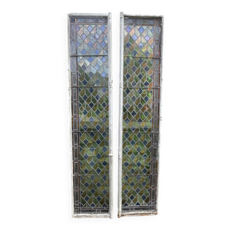 Pair of old double stained glass doors. Metal frames. Stained glass windows