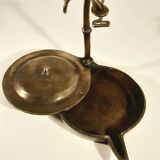 Old oil lamp in golden brass to hang