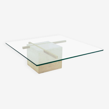 Coffee table with travertine gold-plated cross base and glass top