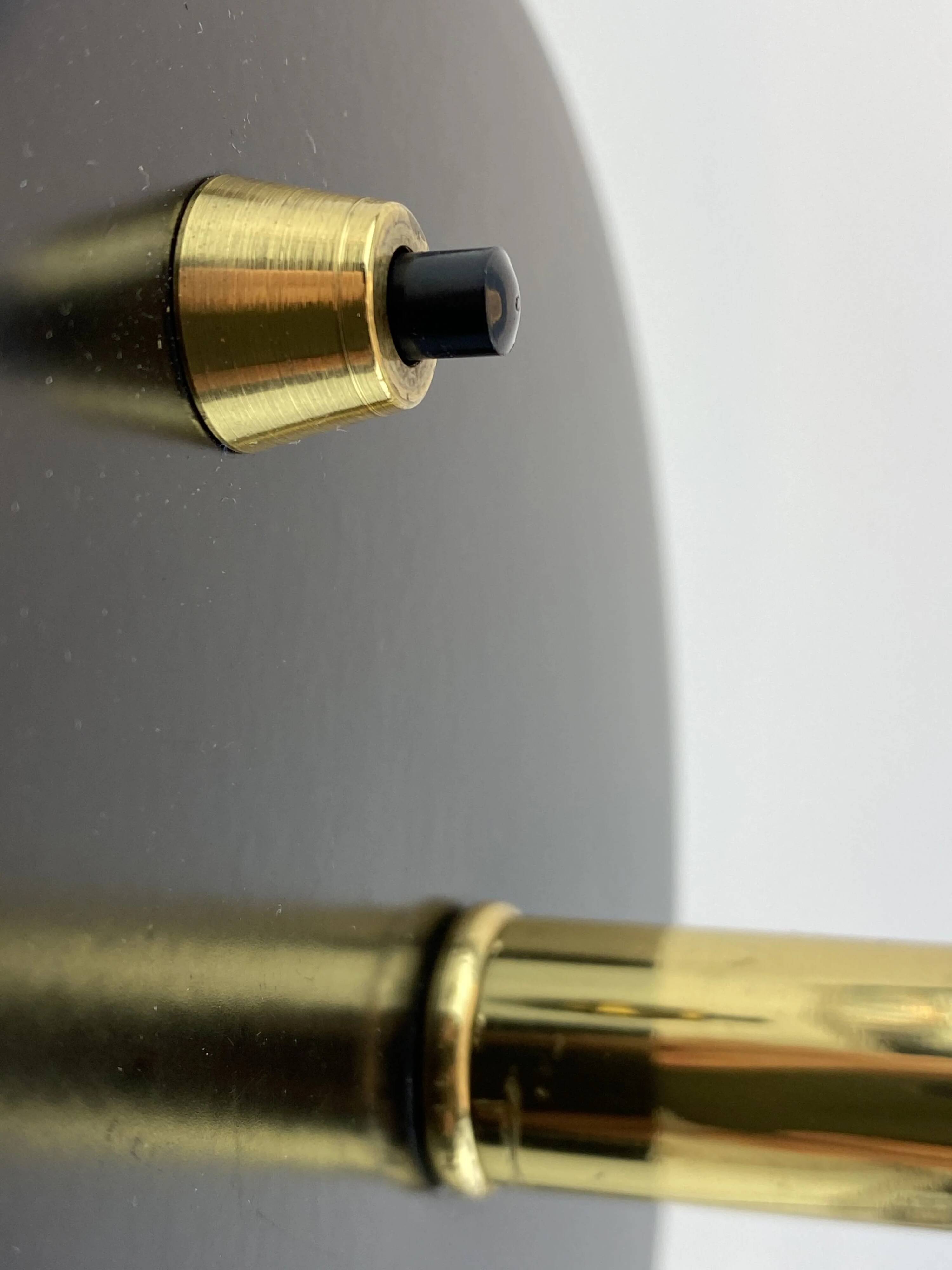 Rare black and gold UFO table lamp by Louis Kalff for Philips.