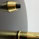 Rare black and gold UFO table lamp by Louis Kalff for Philips.