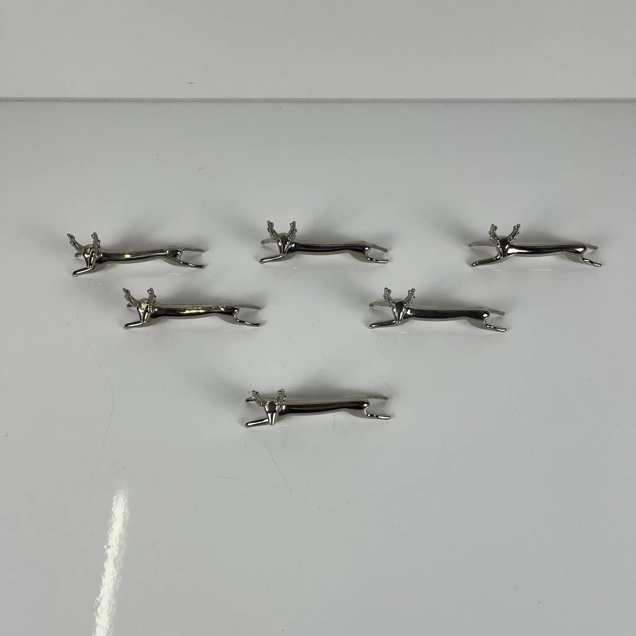 Set of 6 metal knife rests, "Deer / stag" model, 1980-90.