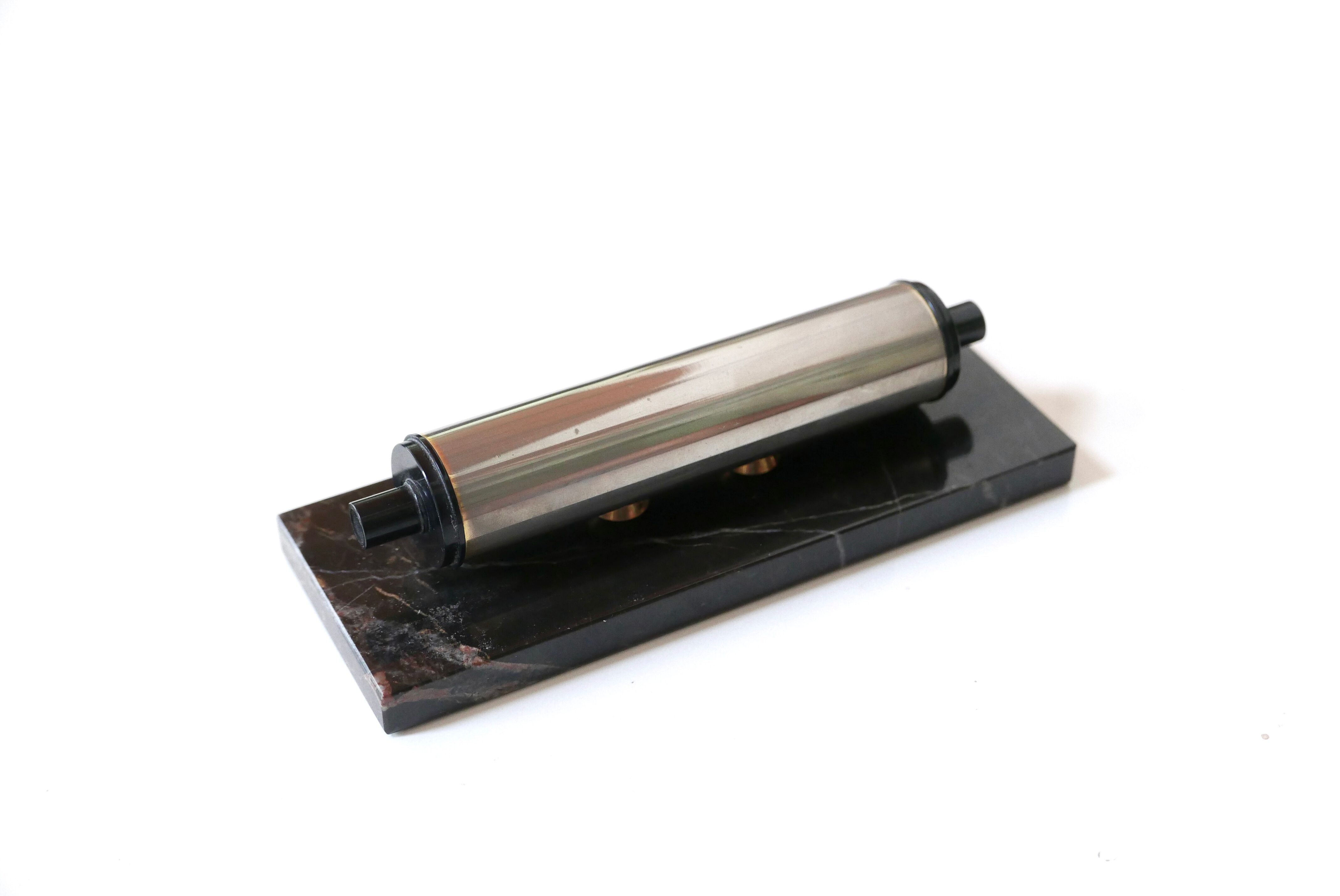 Tubular perpetual calendar, black marble base, 50s