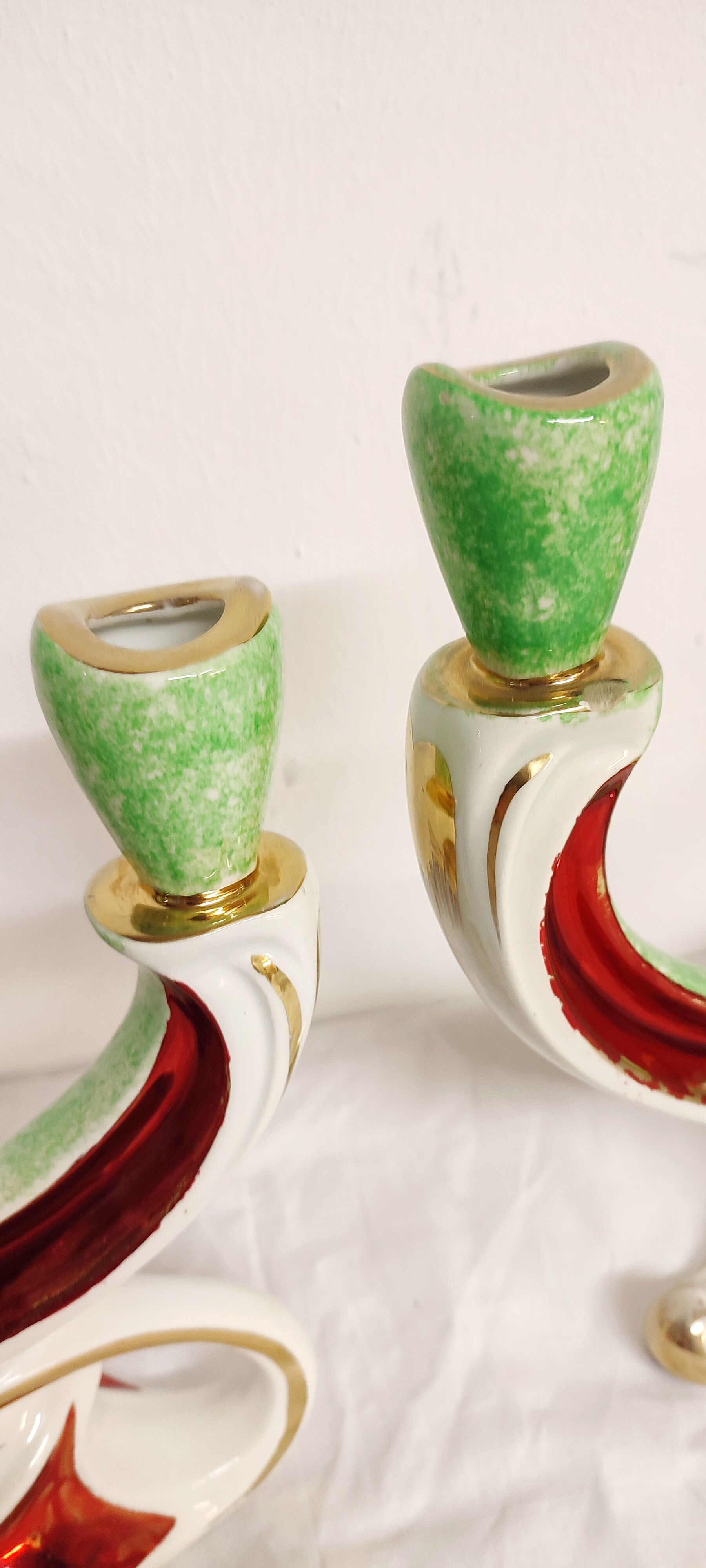 Painted ceramic chandeliers. France, 1950s.