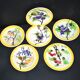 Orchies set of 6 yellow earthenware dessert plates with stencilled fruit decoration.