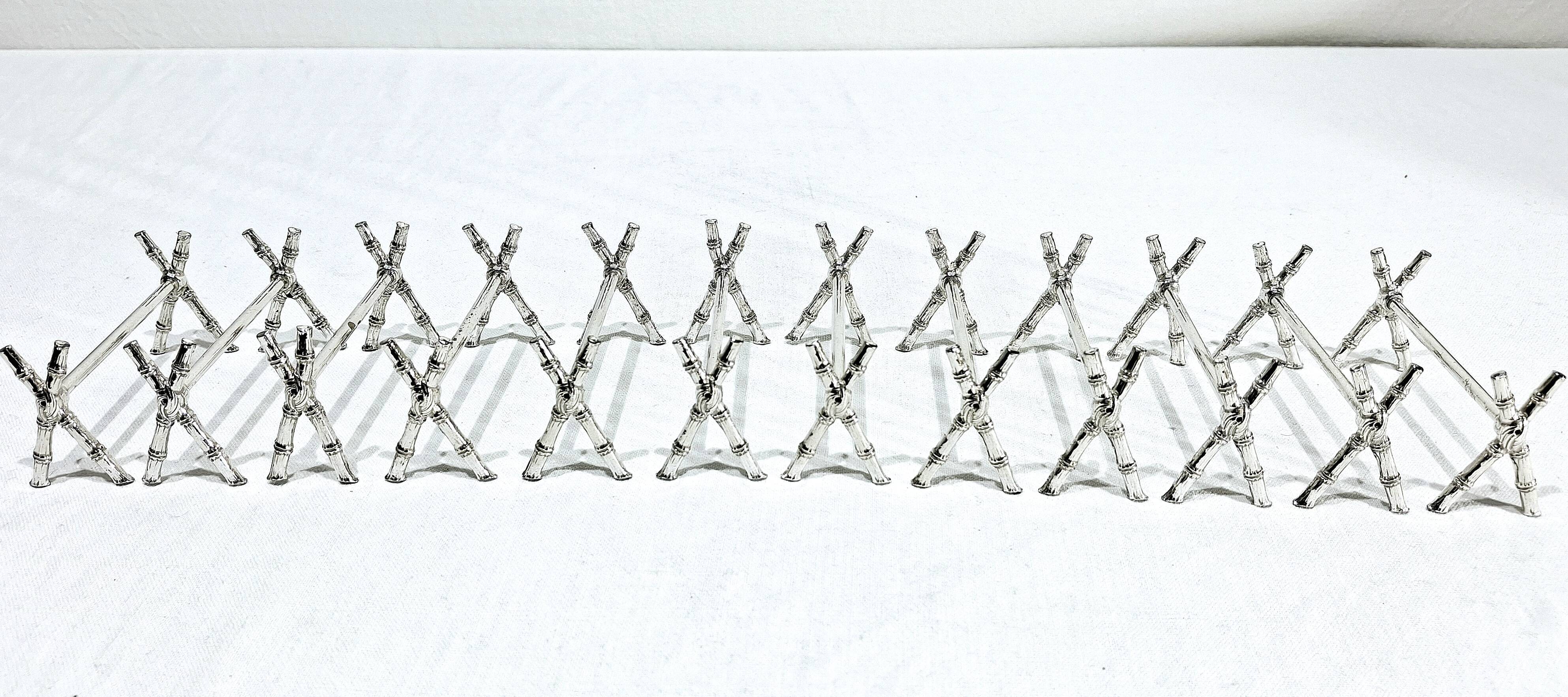 12 silver-plated metal knife handles, in a case.