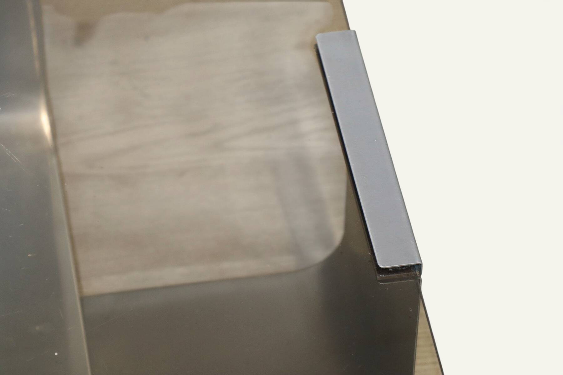 Brushed steel and smoked glass coffee table, by François Monnet – 1970s