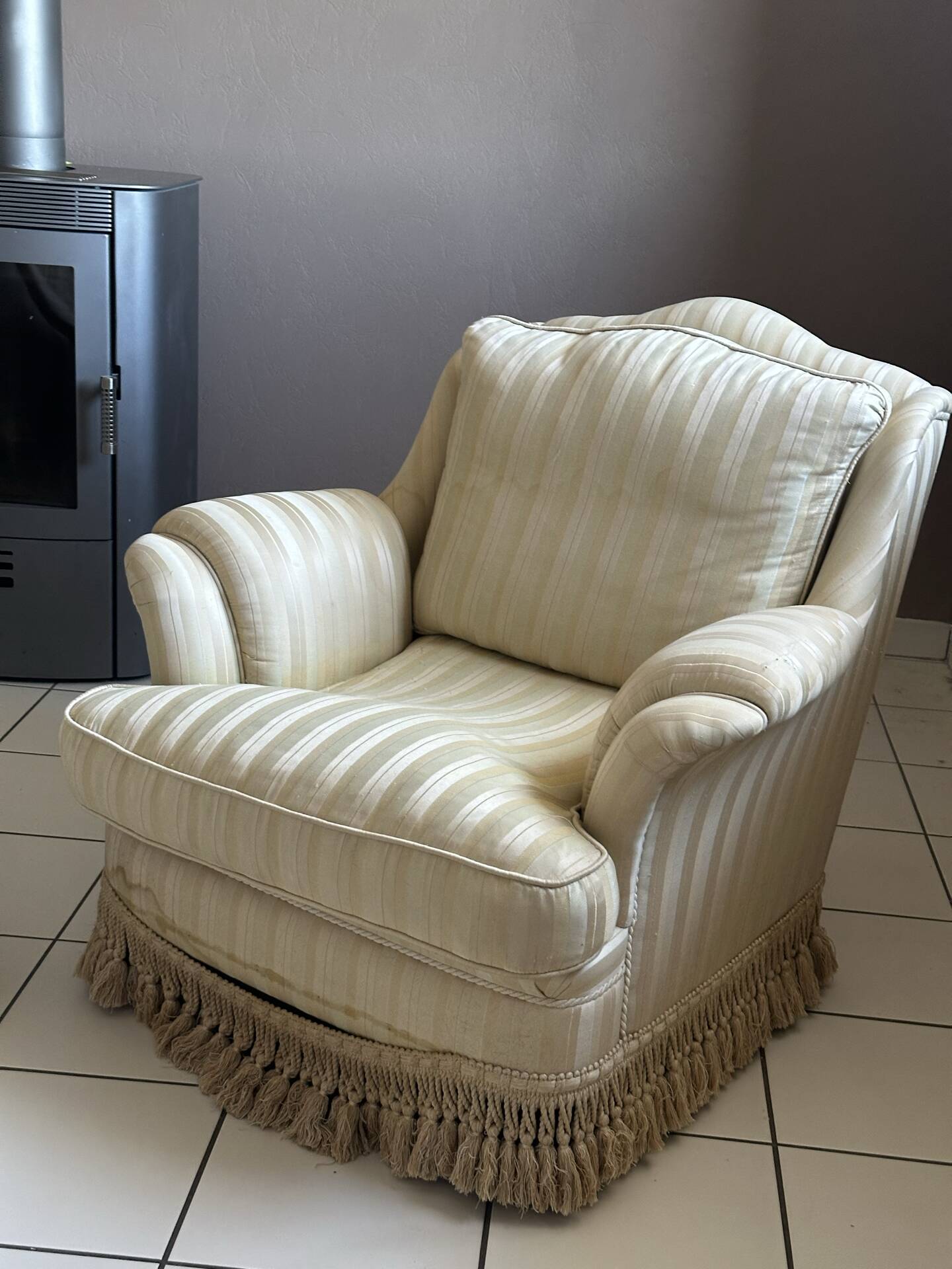 Pair of vintage bergère armchairs in striped ecru and beige fabric.