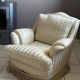 Pair of vintage bergère armchairs in striped ecru and beige fabric.