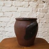 Old red and black terracotta grease pot