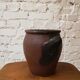 Old red and black terracotta grease pot