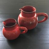 Pair of red pitchers