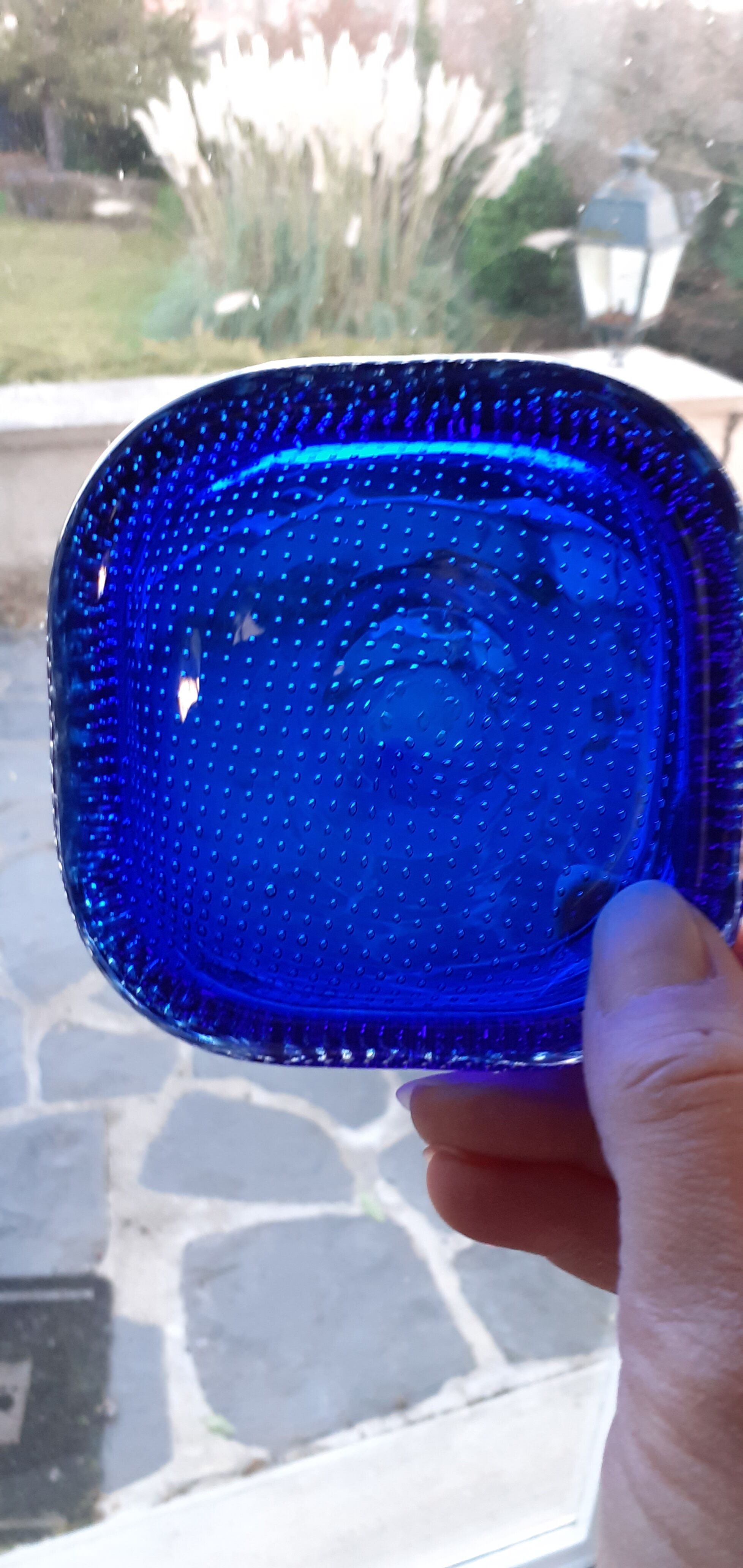 Empty blue bubbled glass pocket