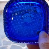 Empty blue bubbled glass pocket