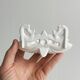 Bathroom décor, hooks, soap dish, white metal hangers.