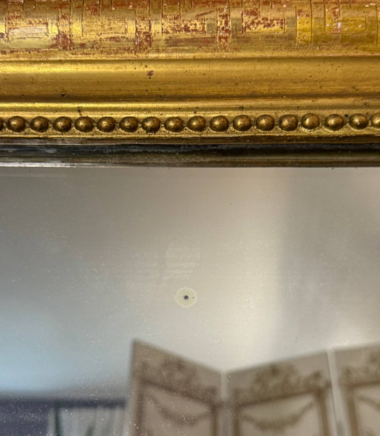 Large Louis Philippe mirror in wood and gilded stucco, 19th century.