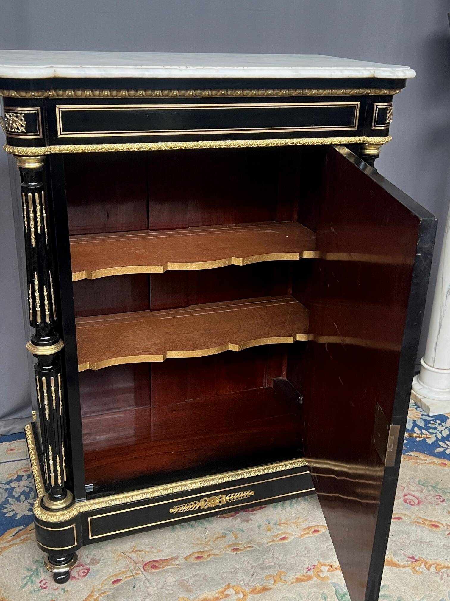 Napoleon III style commode, decorated with brass marquetry and gilded bronze mounts.