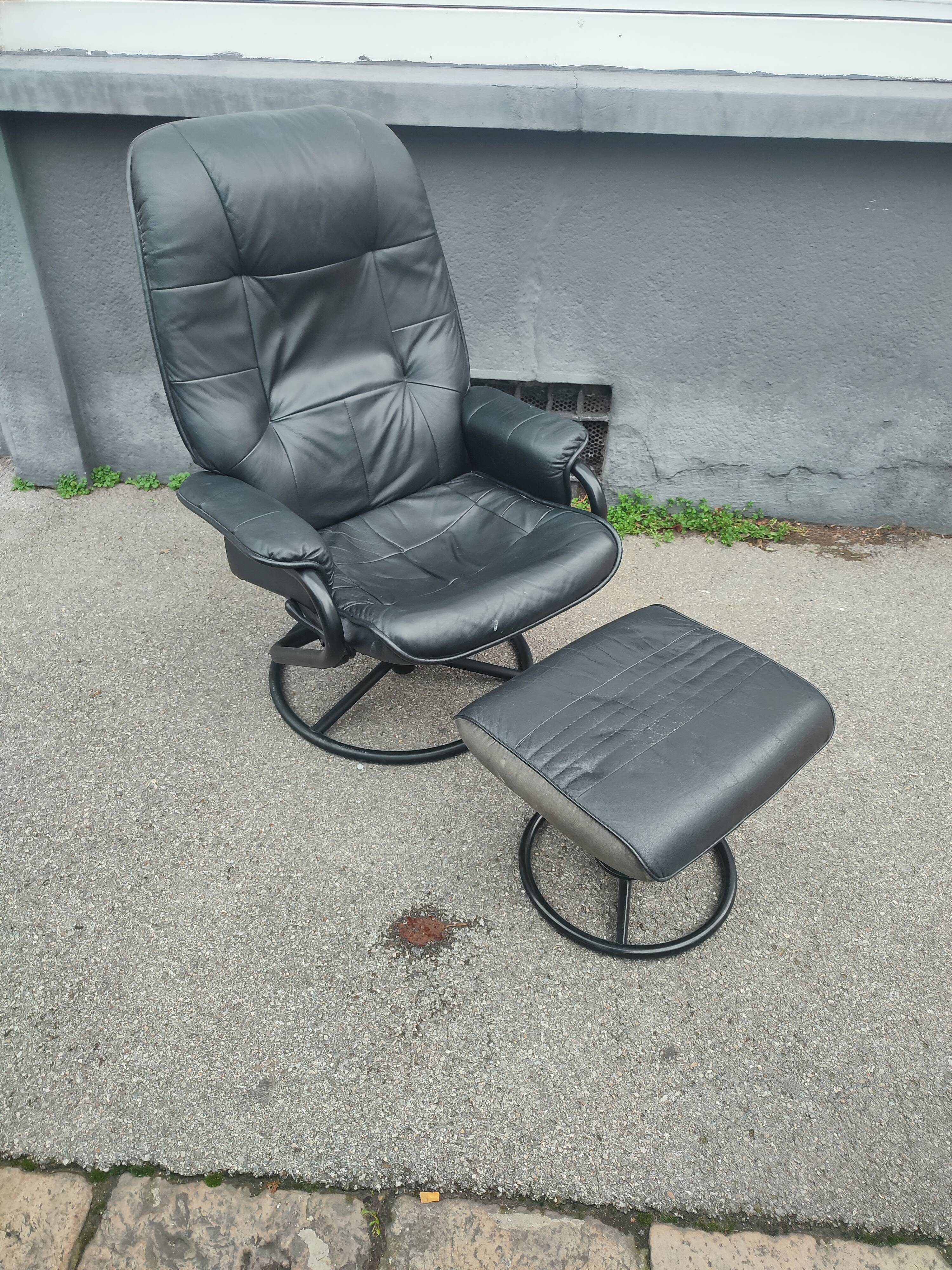 Scandinavian design leather armchair and footrest