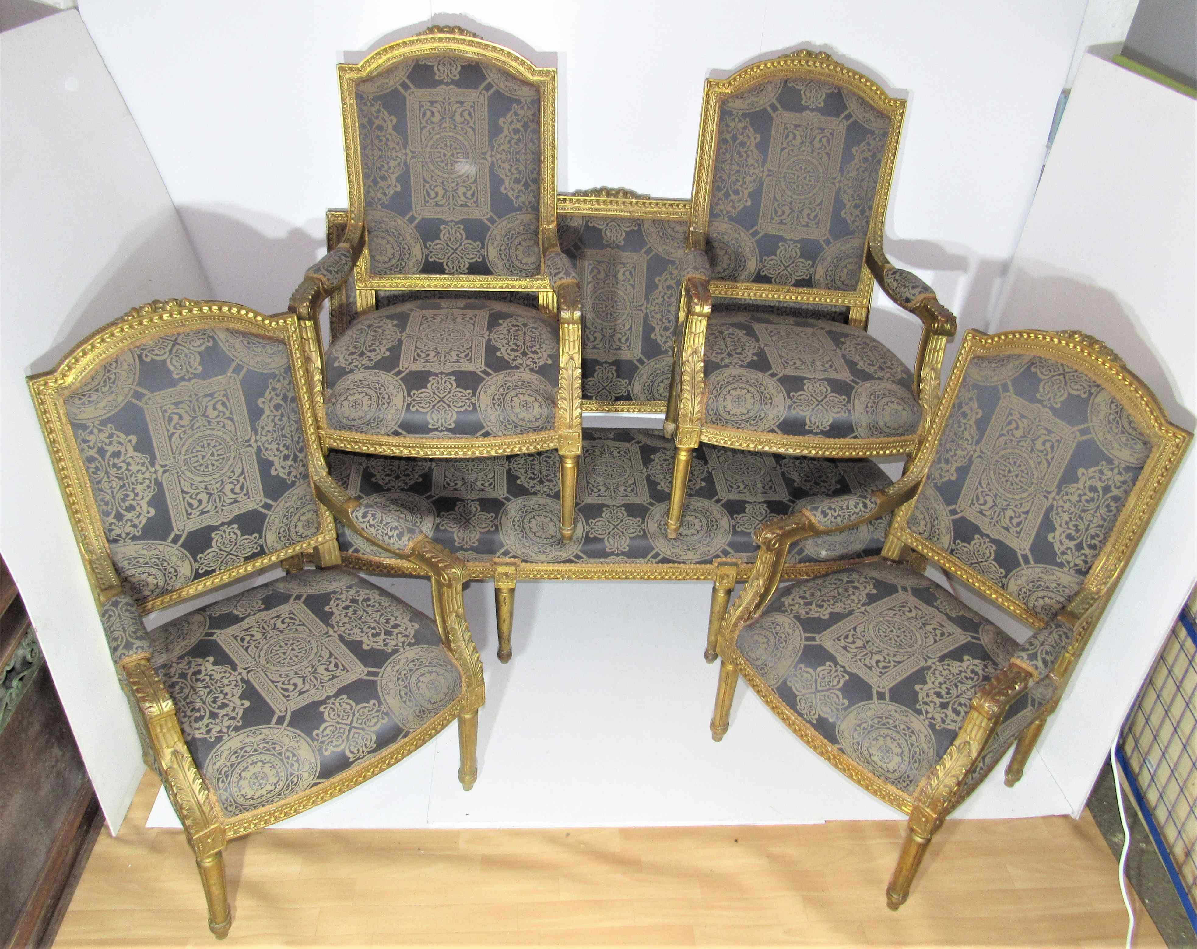4 armchairs and a gilded wooden sofa Louis XVI style