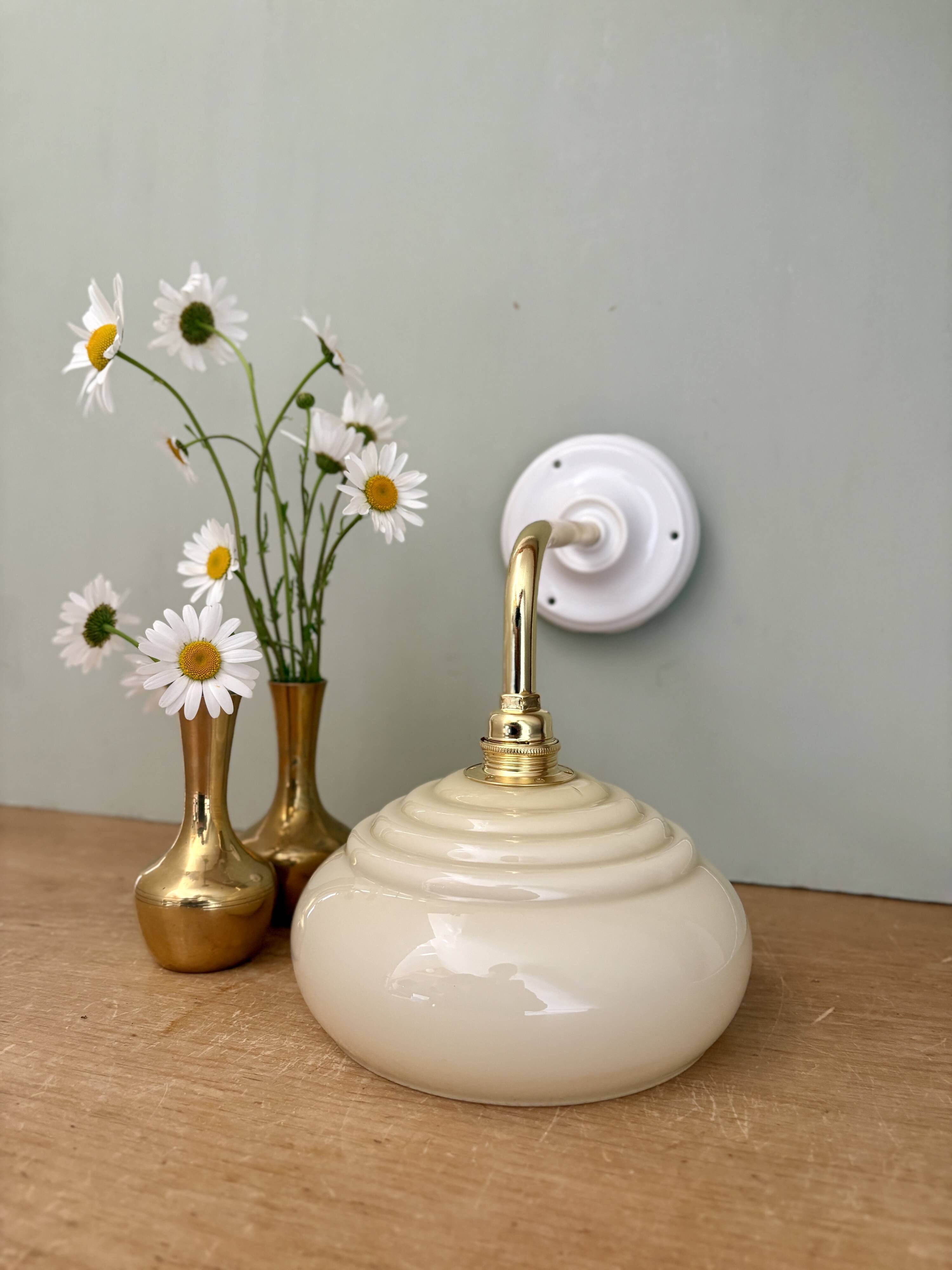Vintage angled wall lamp with pale yellow opaline shade