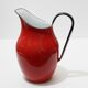 Red enameled metal pitcher