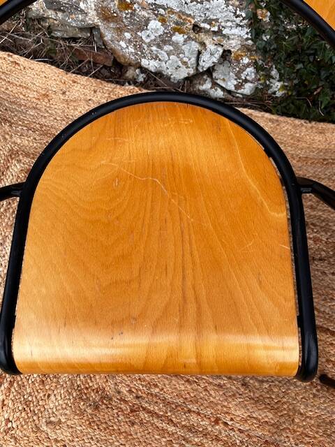 Pair of wooden and black metal chairs