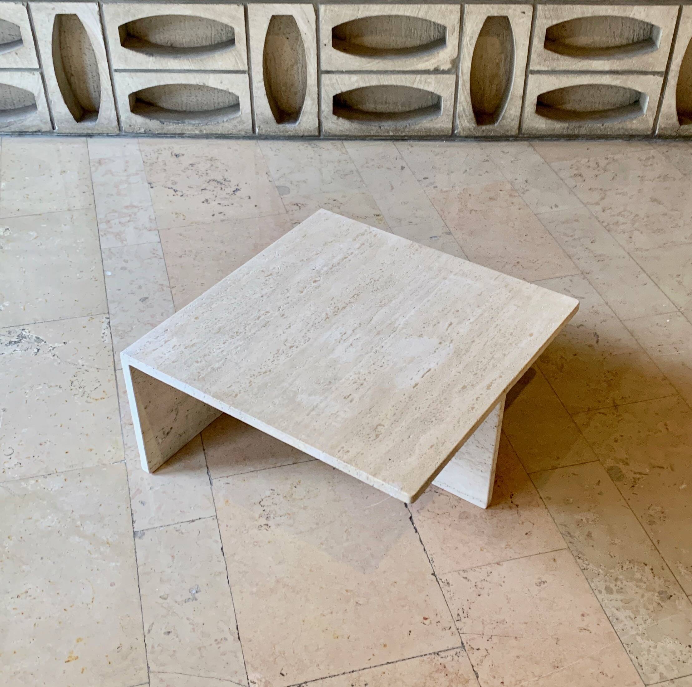 Square travertine coffee table by Giusti and Di Rosa for UP&UP.