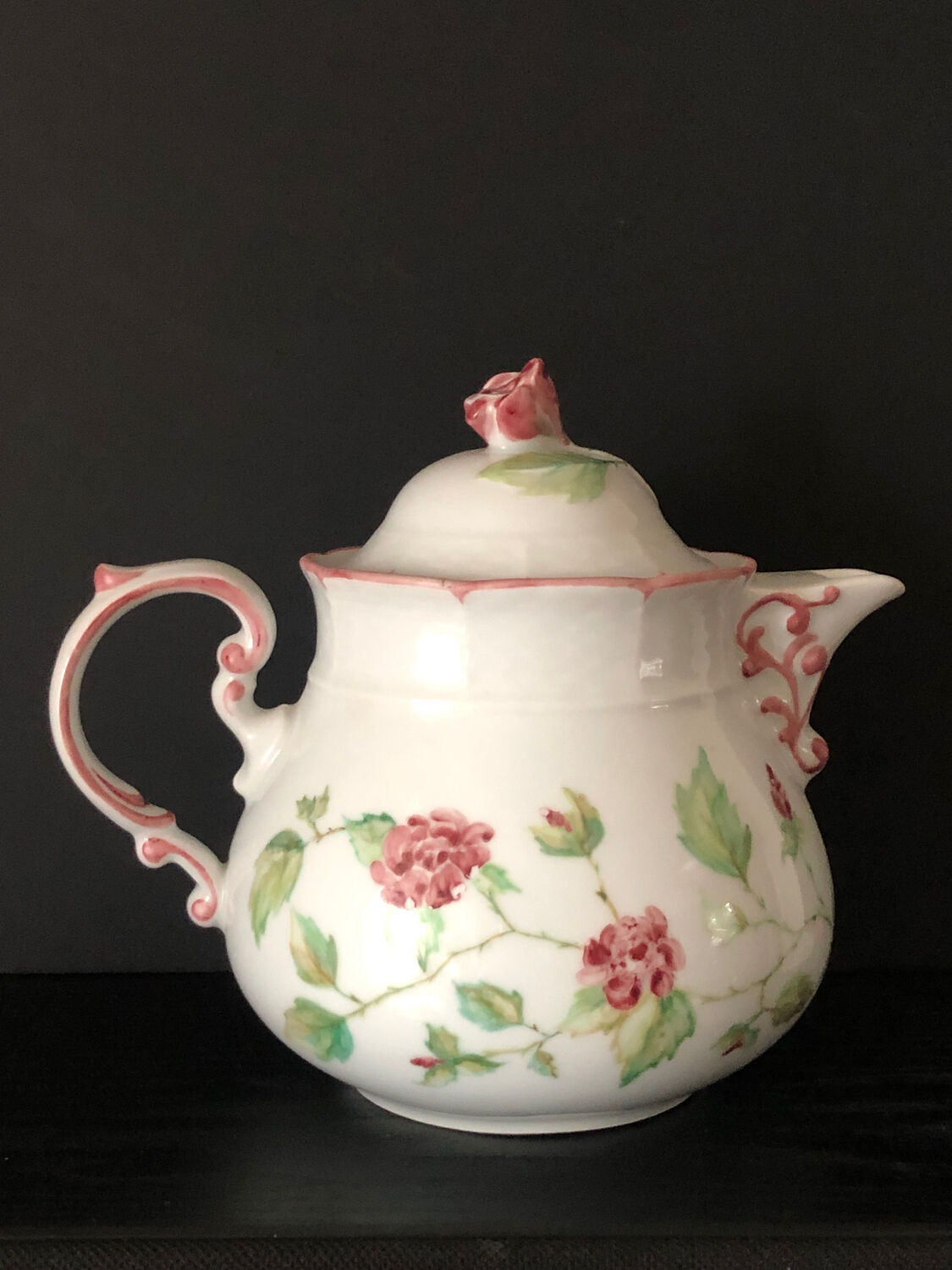 Old white and pink teapot