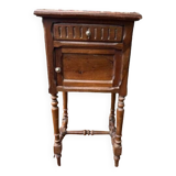 Wooden bedside table with marble top