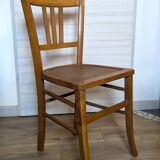 Antique patinated wooden bistro chair from the early 20th century.