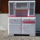 White mado buffet, red handles and tray, hen grill