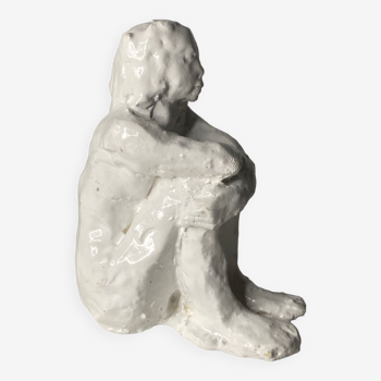 White ceramic seated sculpture