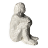 White ceramic seated sculpture