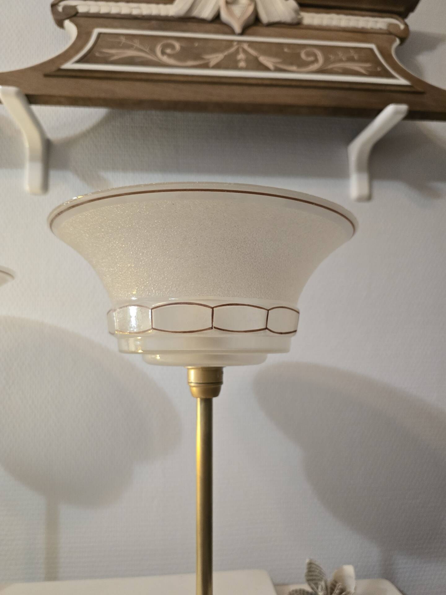 Art Deco table lamps with frosted glass shade and brass base.